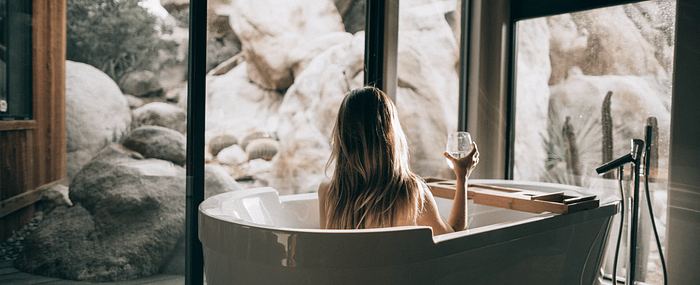 woman enjoying a cbd spa treatment in a tub