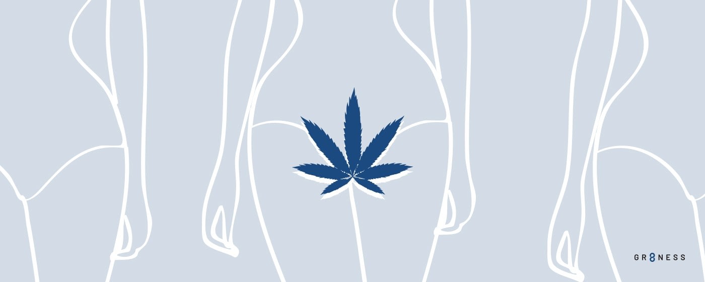 marijuana leaf in front of womans body