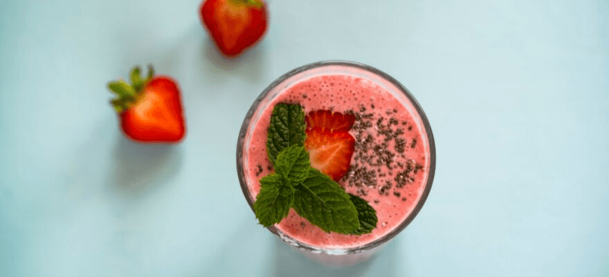 Strawberry CBD smoothie with a fresh strawberry on top