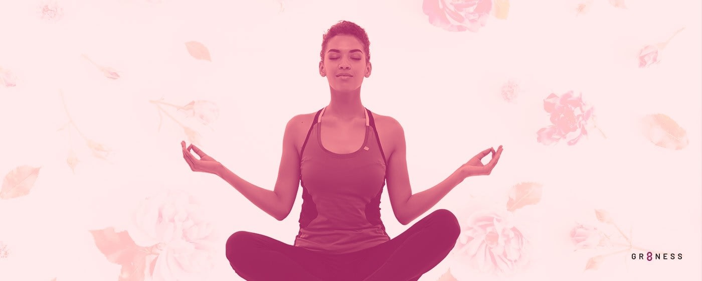 woman meditating with eyes closed and legs crossed