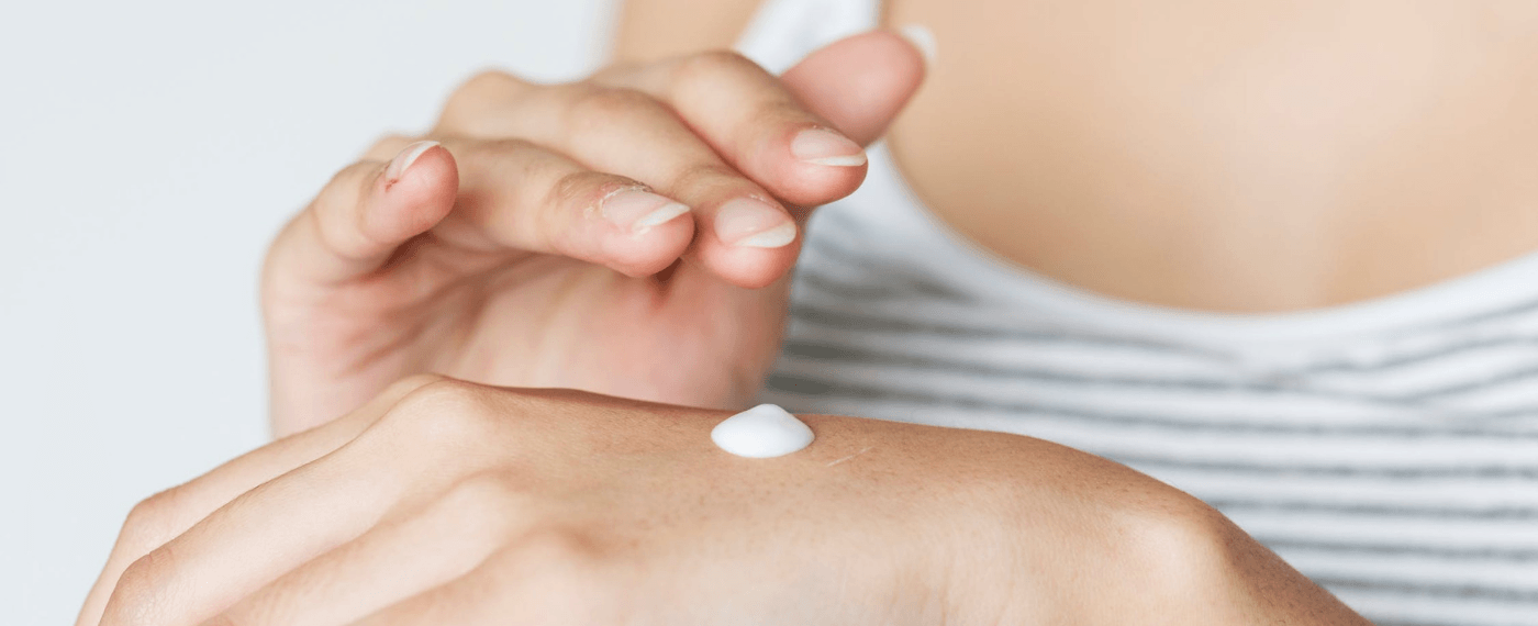 woman applying probiotics for skin care