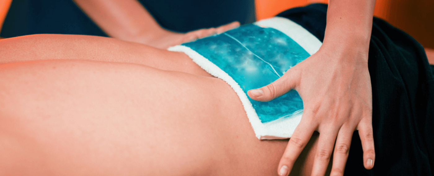 ice back being applied to lower back as a pain remedy