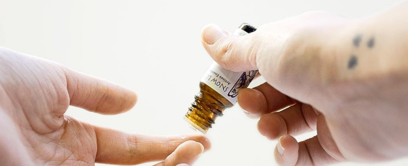 cbd oil being placed on a finger