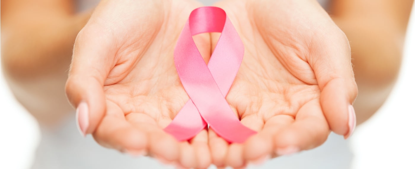 A pink ribbon symbolizing support for women with cancer