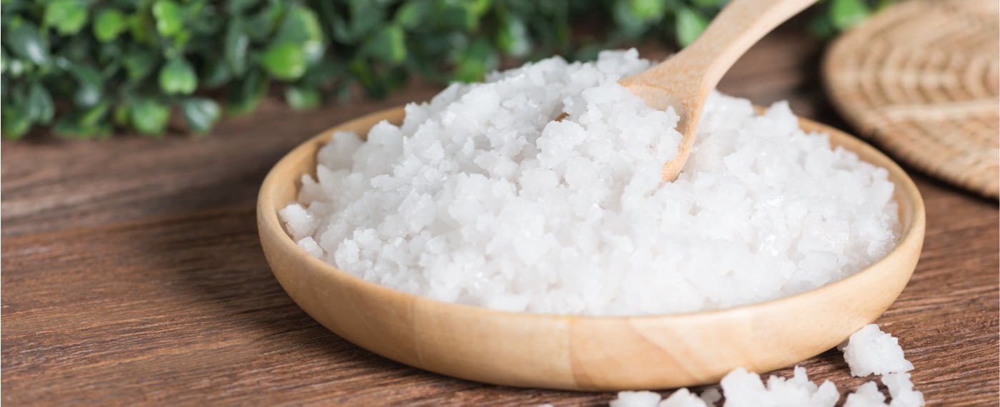 a wooden dish filled with large chunks of epsom salts