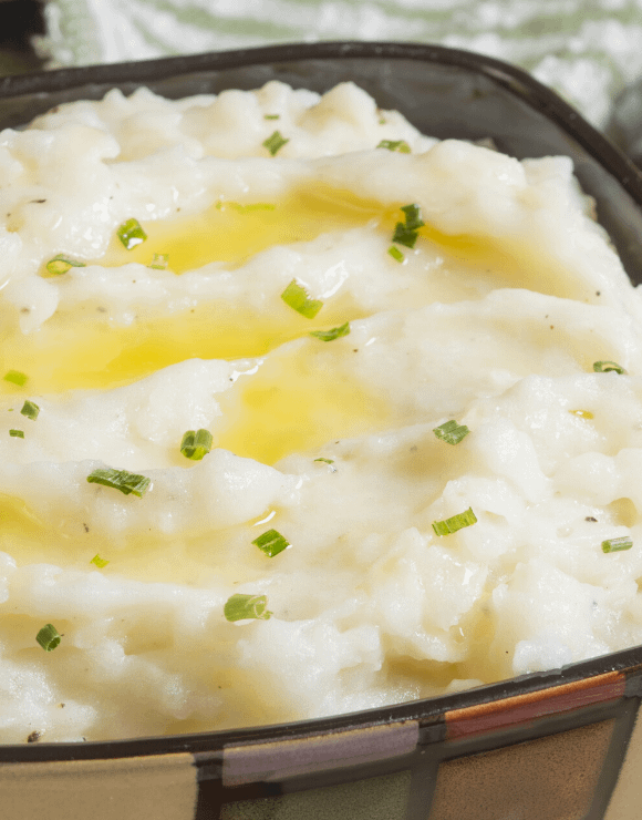 a glass container of garlic mashed potatoes infused with cbd