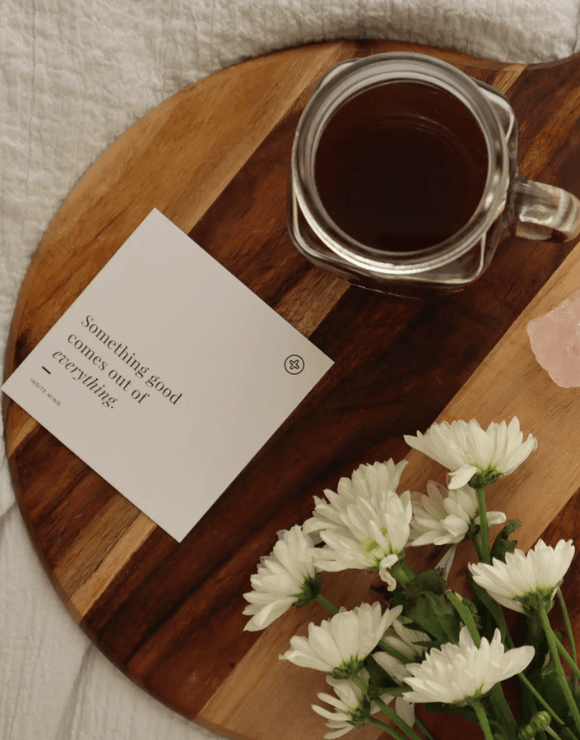 An inspiring note on a platter with flowers