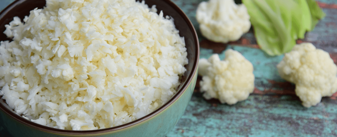 A round bowl of uncooked cauliflower rice