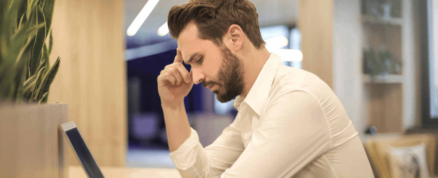 man stressed out while at work