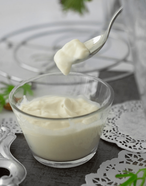 Fermented milk in a small glass turned into yogurt
