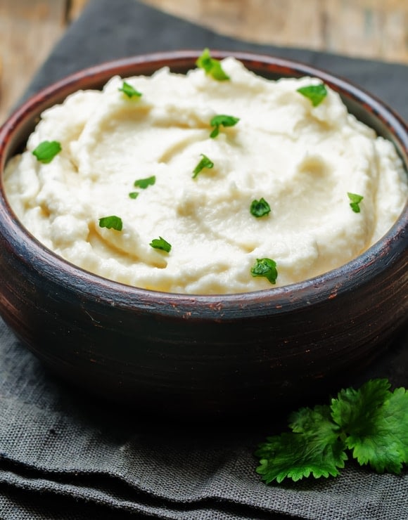 a bowl of health mashed cauliflower for the holidays