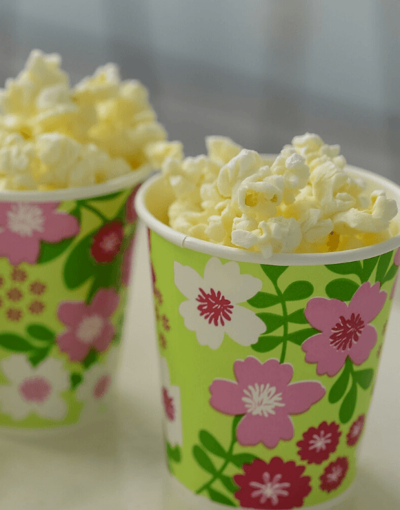 Small floral designed cups filled with popcorn