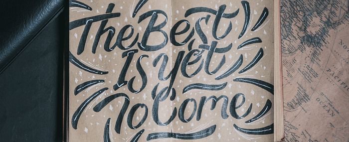 Handwritten text saying the best is yet to come