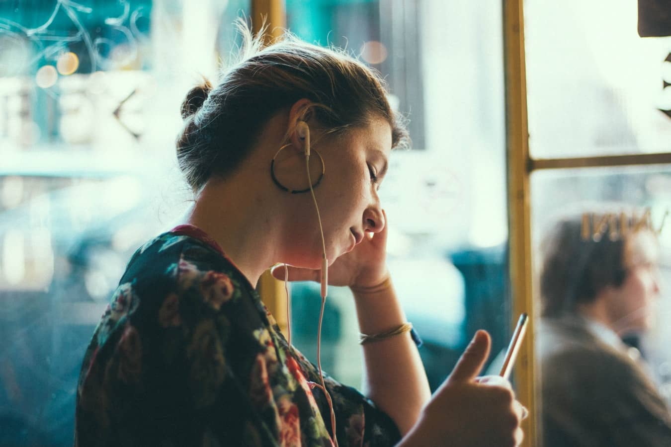 woman browsing through self care podcast on smart phone