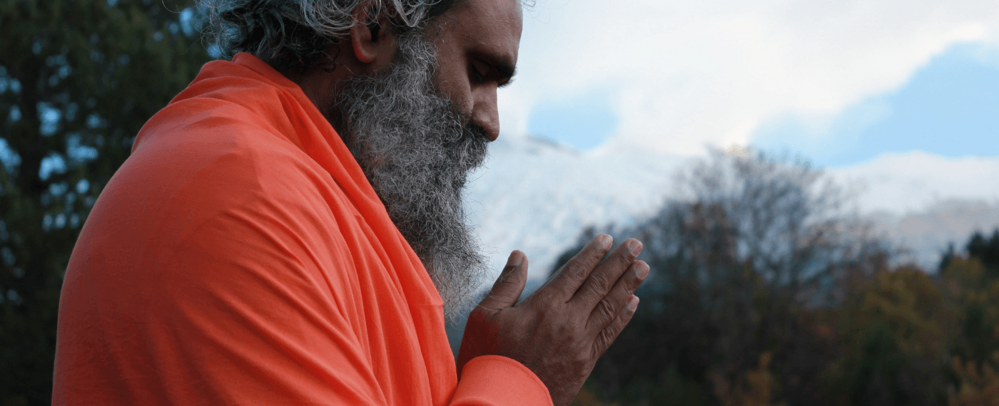 older man meditating to the meaning of namaste