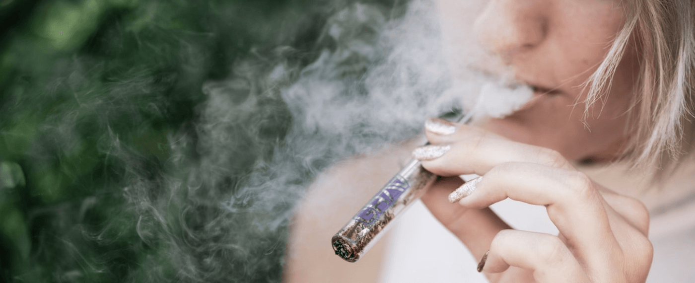 Girl smoking cbd for pain relief