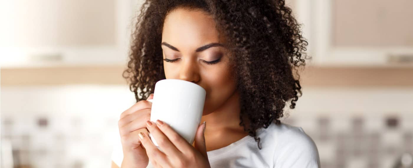 A woman enjoying a cup of tea
