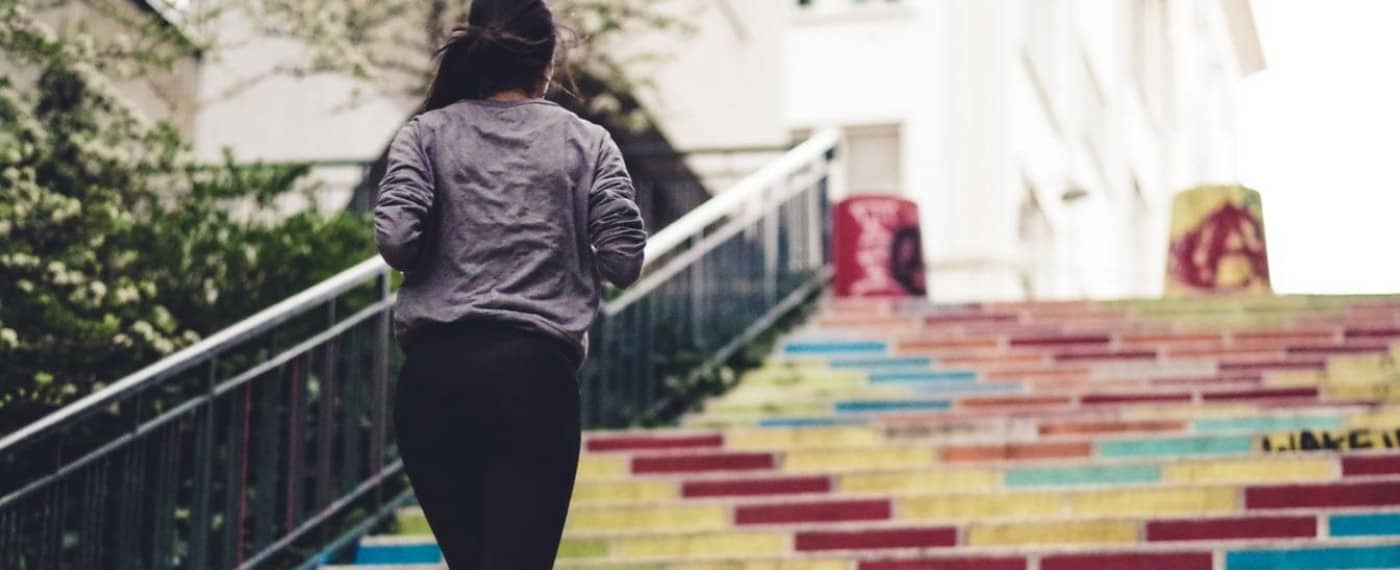 girl running up stairs to promote exercise and eating healthy