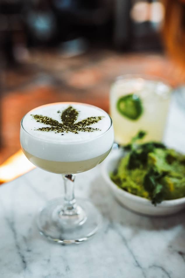 A martini glass filled with a CBD cocktail
