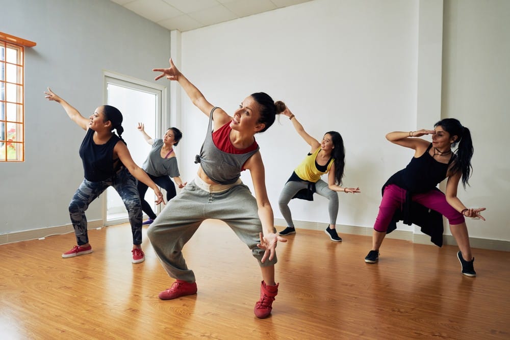 Group of women practicing hip hop dancing to stay fit