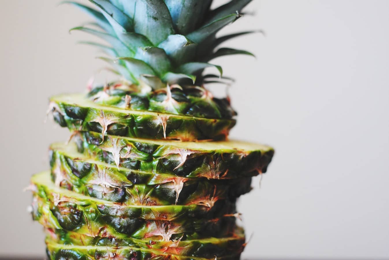 Pineapple sliced up into the shape of a whole pineapple