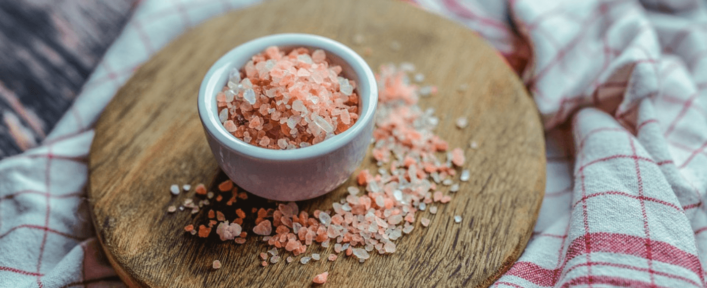 a cup of pink Himalayan salt