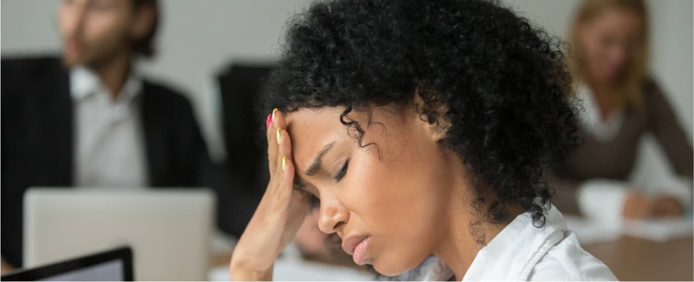 a woman experiencing the physical effects of stress