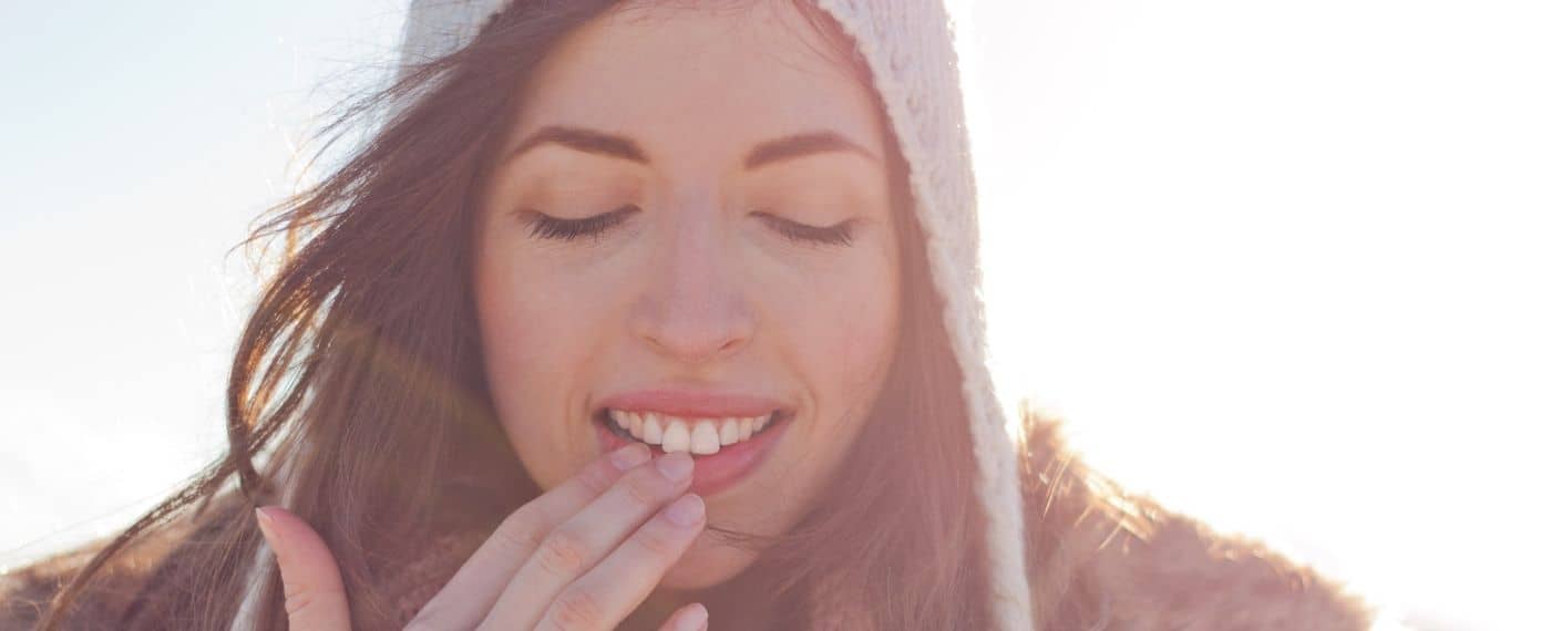 A woman satisfied with her DIY lip balm