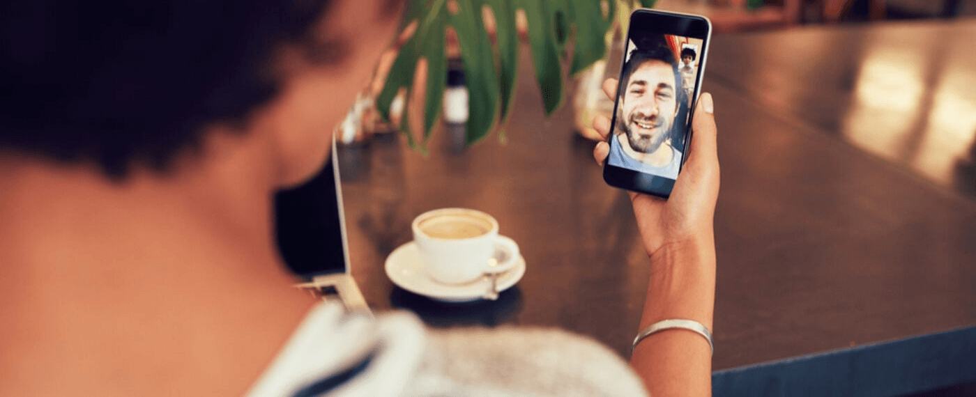 couple in long distance relationship face timing each other