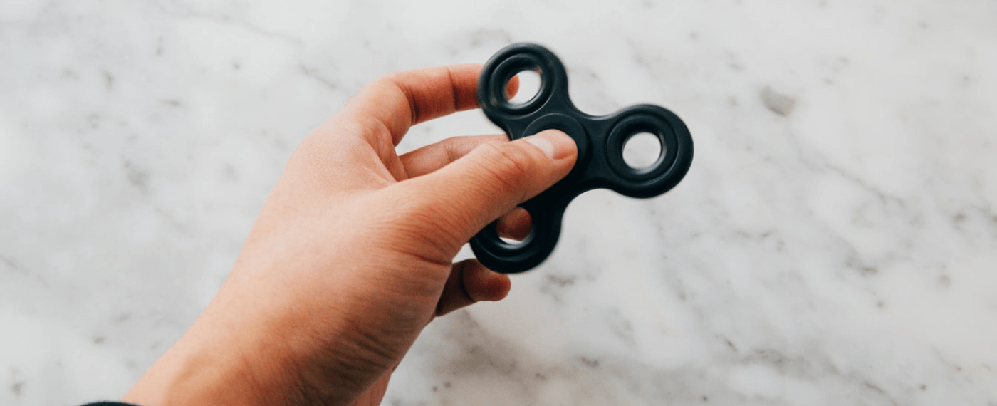 a black fidget spinner for adults with ADD or ADHD
