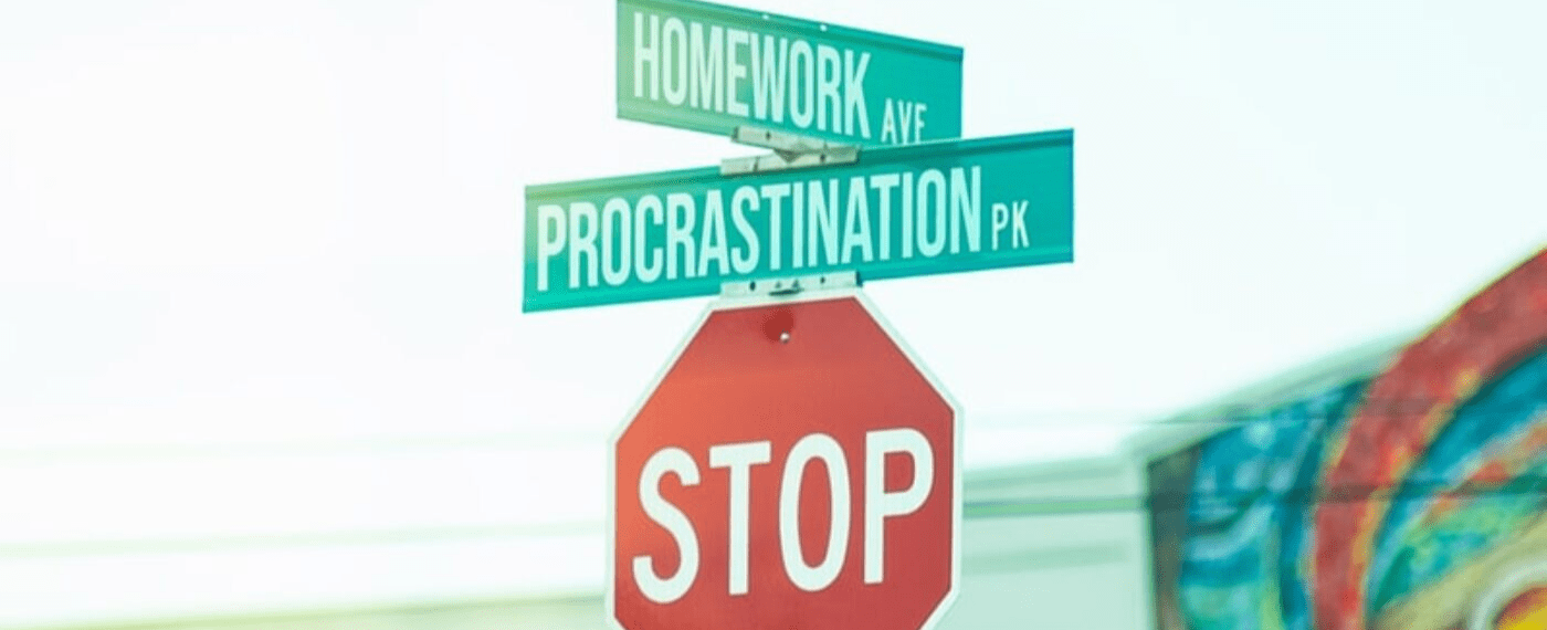 A stop sign with Homework Ave and Procrastination Park road signs in top
