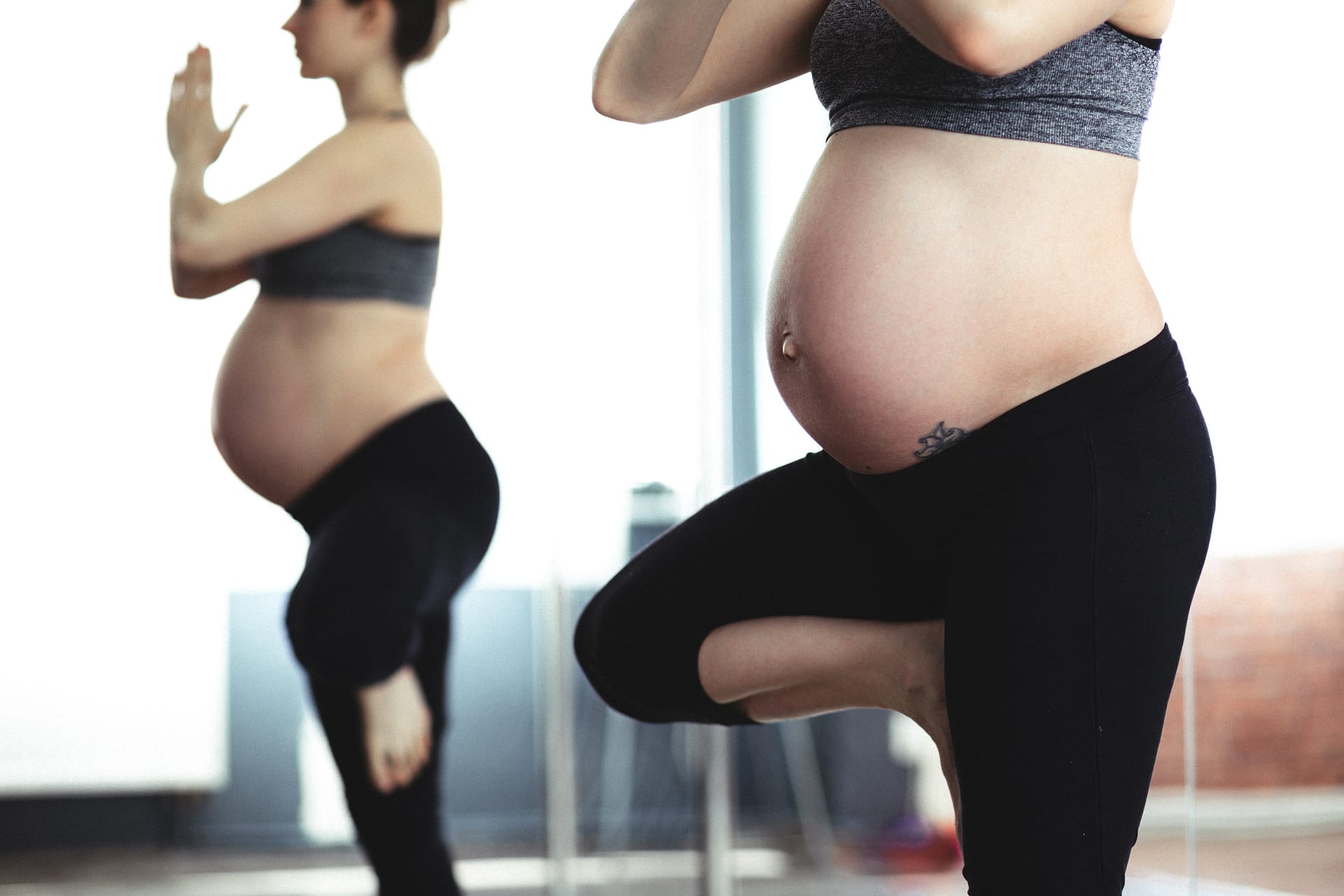 pregnant mother practicing safe pilates