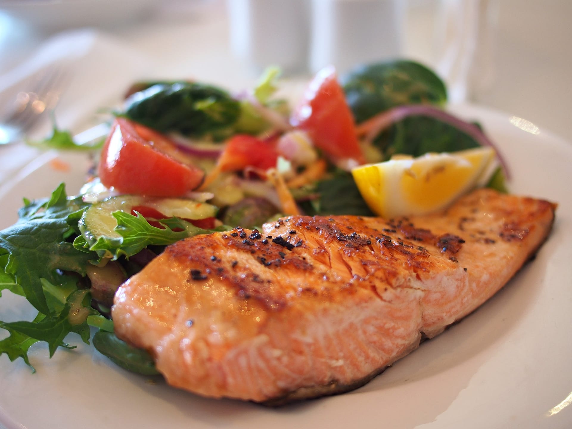 A plate of seared salmon and vegetables