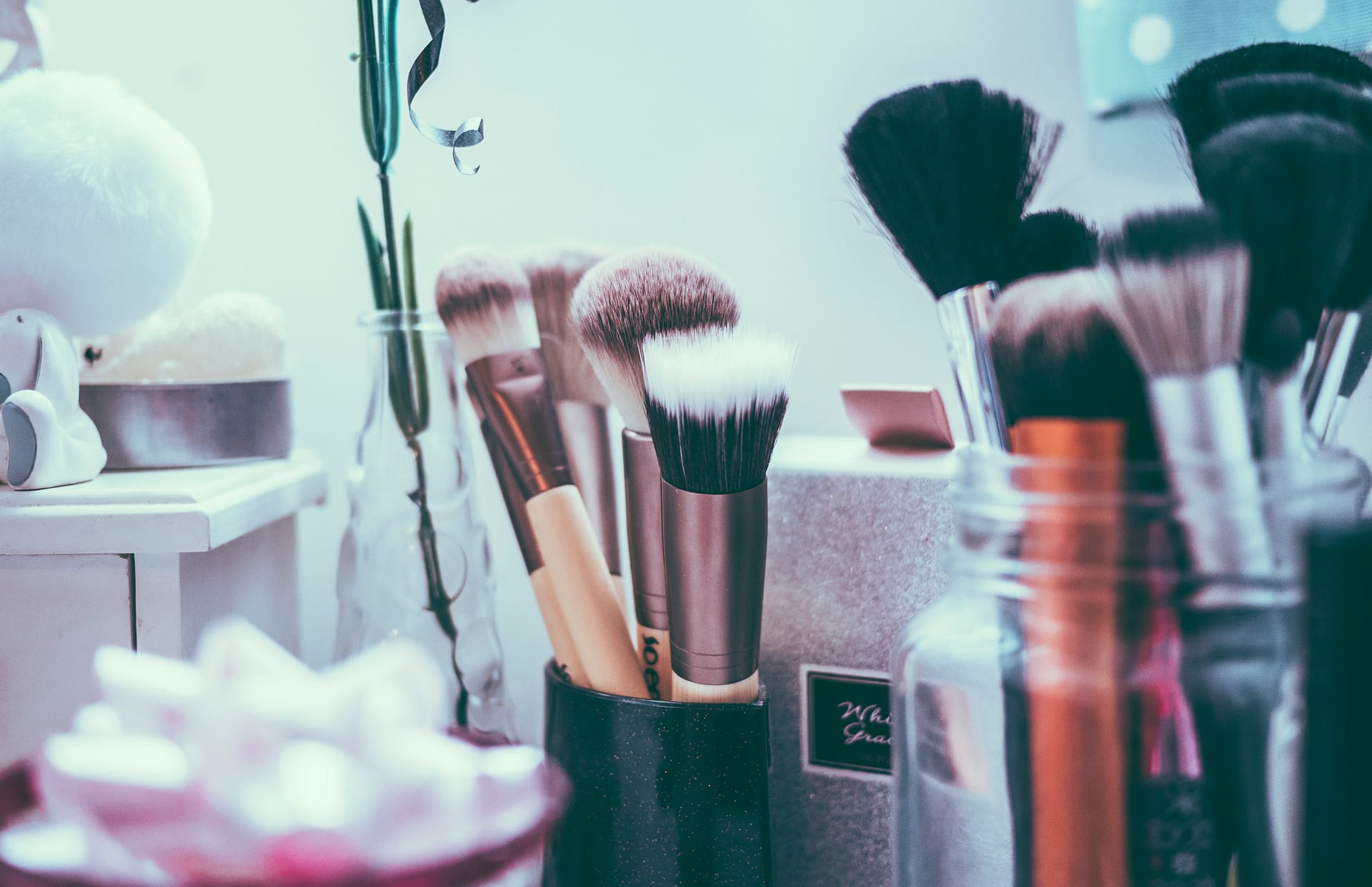 A collection of makeup brushes used for self-pampering