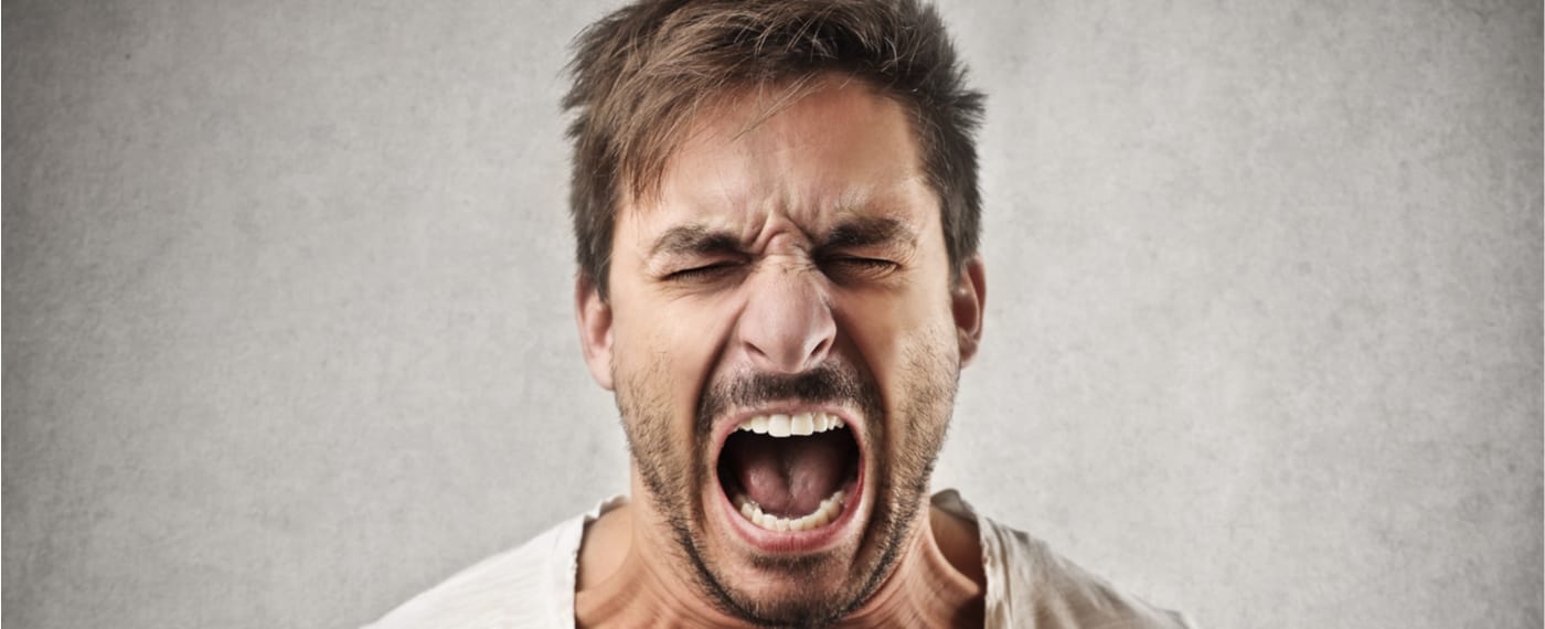 An enraged man loses his temper