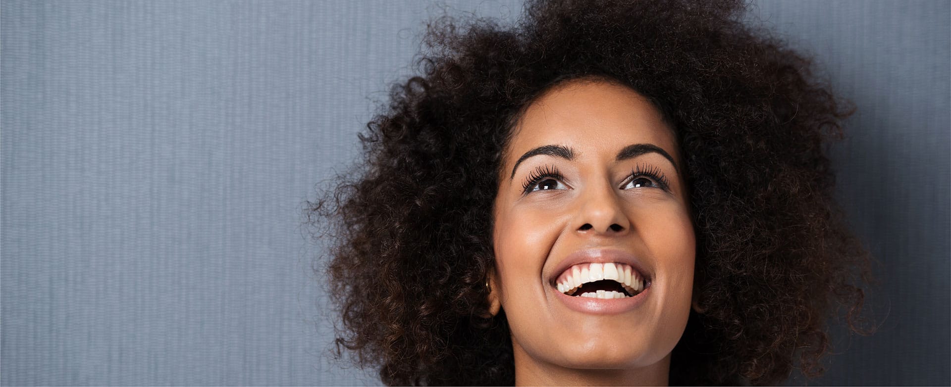 Woman smiling with mouth open