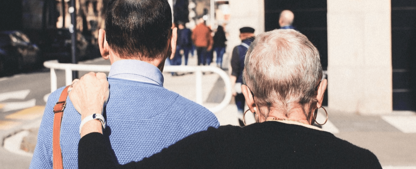 Man and woman walking down a city street