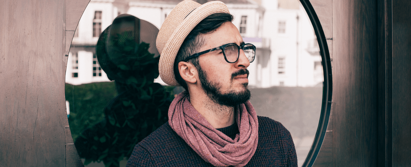 A stylish but pensive man reflects on his own biases