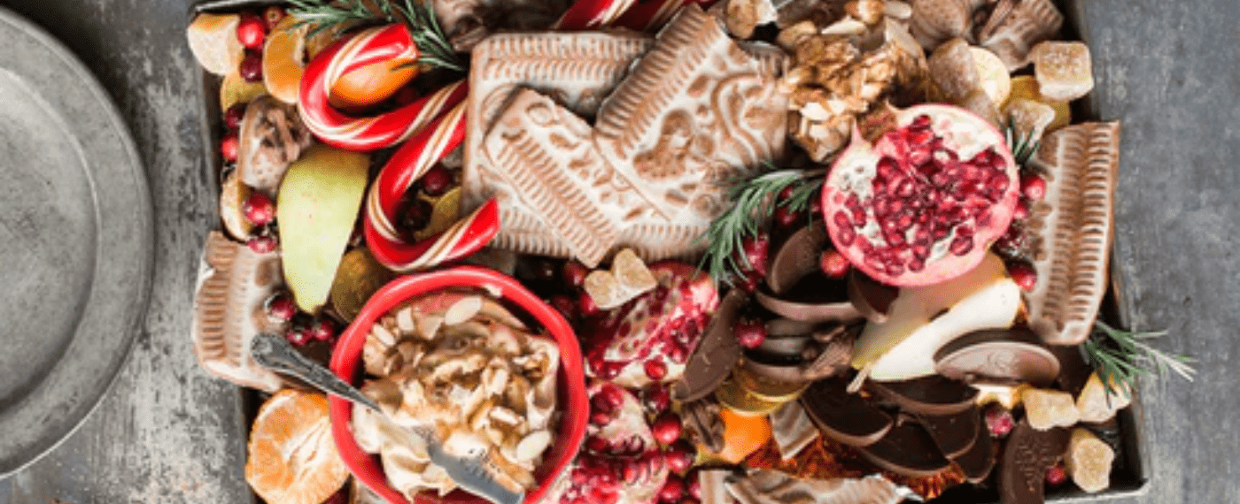 A holiday basket filled with different sweets and cookies
