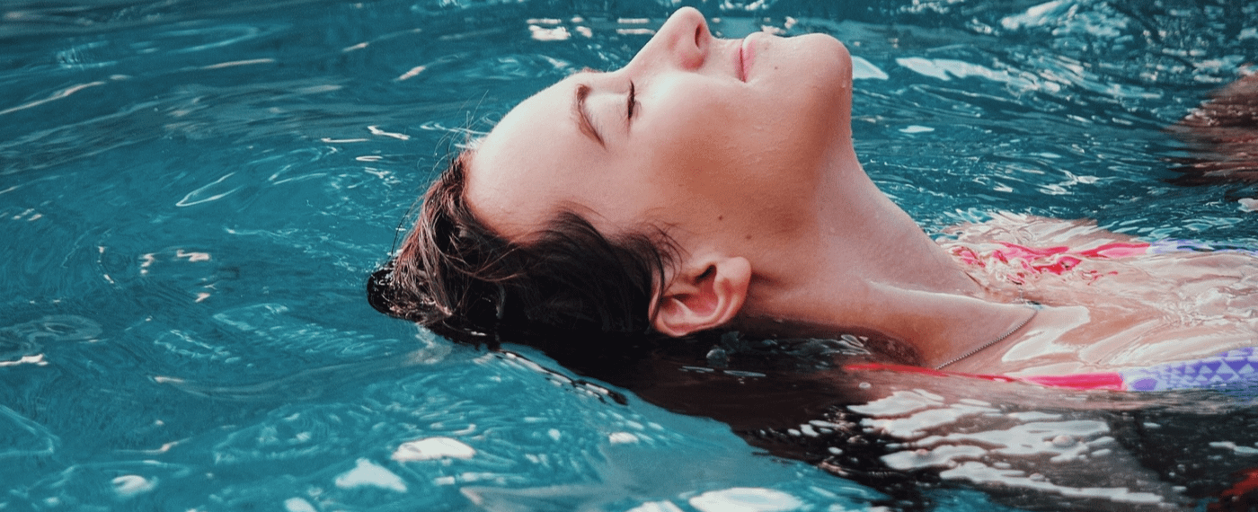 A woman relieving stress while submerged in an isolation tank