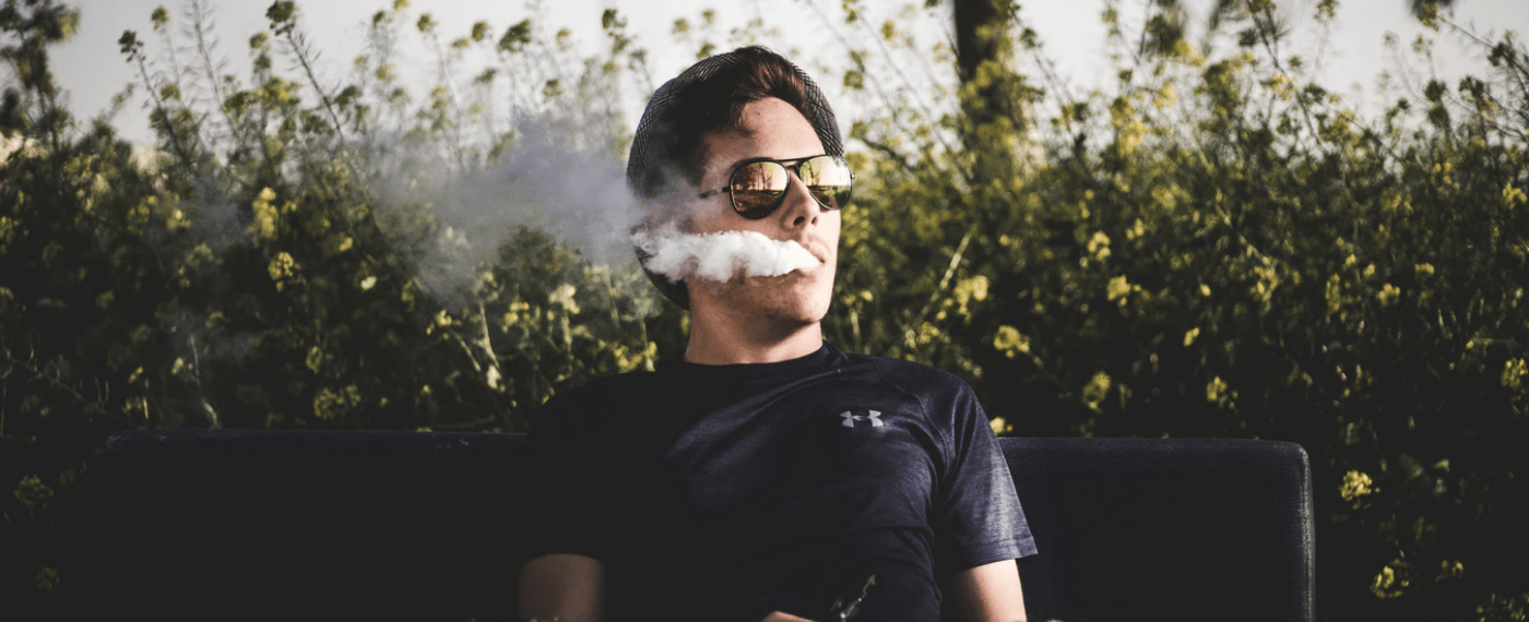 man blowing smoke from vaping