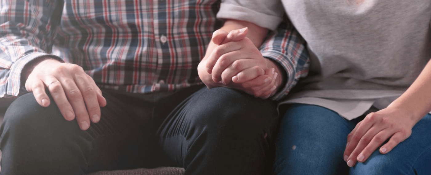 Woman and man holding hands before speaking about sexual needs