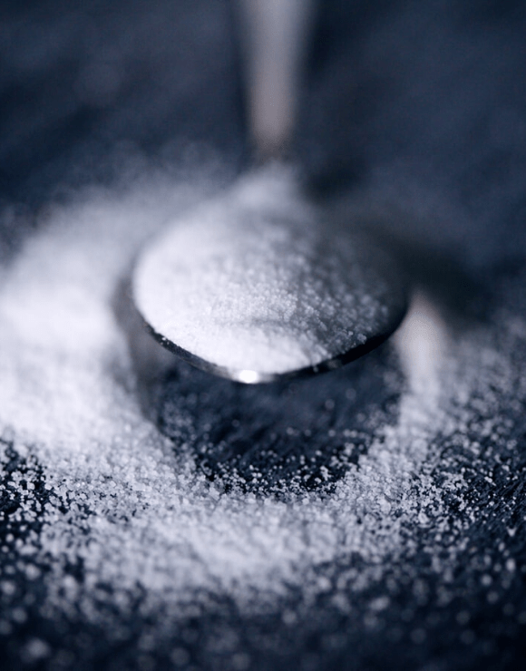 a tablespoon overflowing with granulated sugar