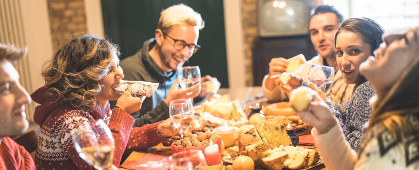 Family enjoying food and wine to ease stress