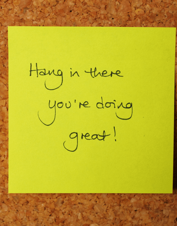 A post-it note with the phrase 
