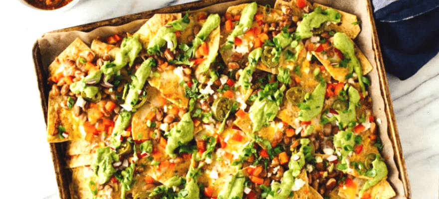 Healthy loaded veggie nachos using gluten-free tortilla corn chips