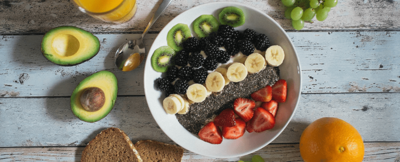 a large bowl of freshly cut fruit and chia seeds
