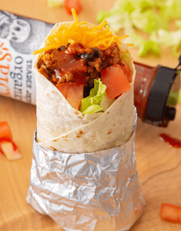 Trader Joe’s Organic Spicy Taco Sauce on top of a beef and bean burrito
