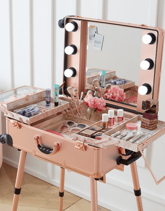 A foldout makeup trunk and vanity mirror combination