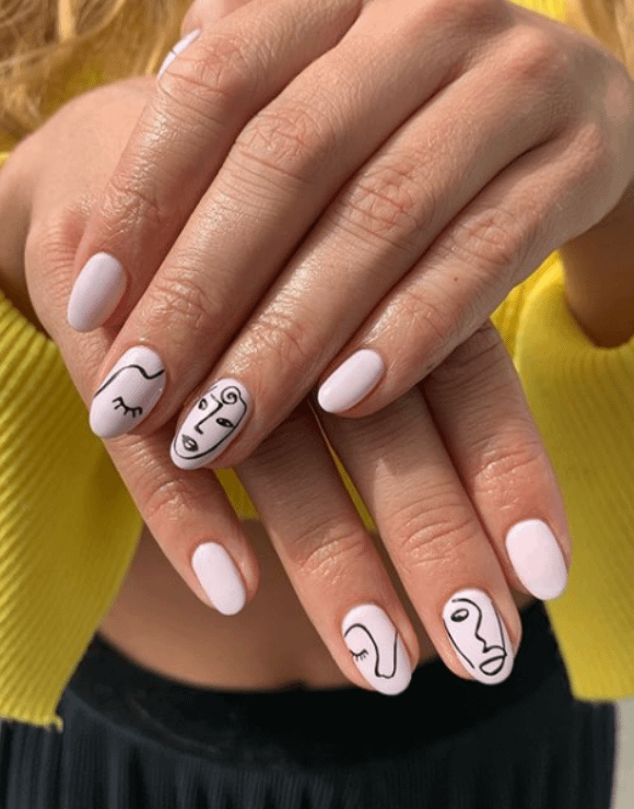 intricate art-pop pieces painted onto manicures
